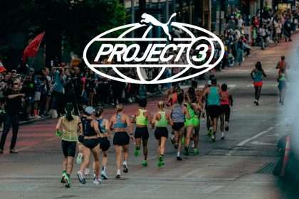 Corredores de PUMA PROJECT3 en la ruta de un maratón